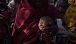 Mother and baby take refuge from drought and hunger at a refugee camp in Somalia. Giles Clarke via Getty Images