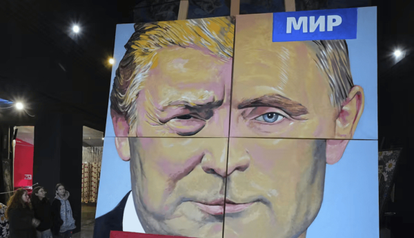 ‘Peace to the World,’ a painting created by a Russian artist, combines the faces of Russian President Vladimir Putin and U.S. President Donald Trump in St. Petersburg, Russia, on March 14, 2025. (AP Photo/Dmitri Lovetsky)