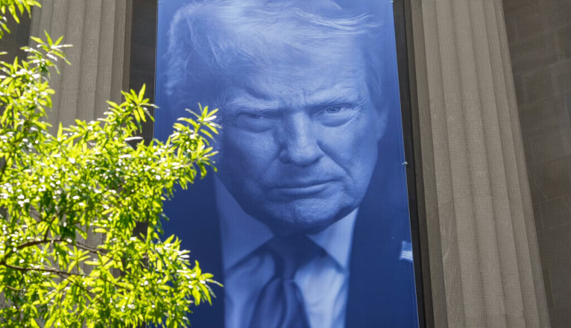 A banner featuring President Trump on the outside of the DOJ building in Washington, D.C. Andrew Harnik/Getty Images