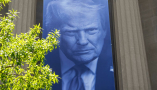 A banner featuring President Trump on the outside of the DOJ building in Washington, D.C. Andrew Harnik/Getty Images