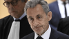 Nicolas Sarkozy quitte le tribunal correctionnel de Paris le 25 septembre 2025 après avoir été condamné à cinq ans de réclusion avec mandat de dépôt à effet différé assorti d’une exécution provisoire. AFP