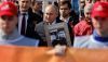 Never forget: Vladimir Putin marching in the Victory Day ‘Immortals Parade’ with a picture of his father, May 2022. REUTERS/Maxim Shemetov