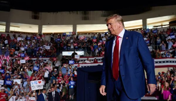 Former President Donald Trump makes his way to the stage during a rally in Erie, Pa., on July 29, 2023. Dustin Franz for The Washington Post via Getty Images