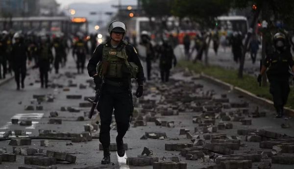 Clashes on the streets of Peru. Ernesto Benavides/AFP via Getty Images)