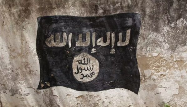 An Al-Shabaab flag on the wall of a former school in Mogadishu in December 2011. Photo by Noe Falk Nielsen/NurPhoto via Getty Images