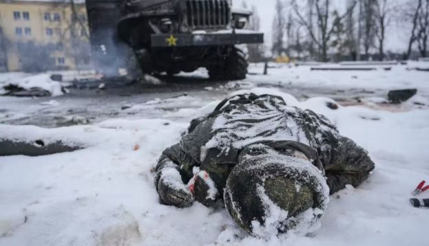 A soldier’s body lies next to a destroyed Russian truck on the outskirts of Kharkiv, Ukraine, on Feb. 25, 2022. AP Photo/Vadim Ghirda