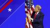 Donald Trump hugs an American flag as he arrives at the Conservative Political Action Conference on Feb. 24, 2024, in Baltimore. Anna Moneymaker/Getty Images