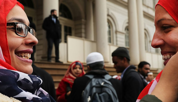 Two police officers wear American flag head scarfs at a World Hijab Day event on Feb. 1, 2017, in New York City. Spencer Platt/Getty Images