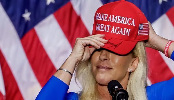 Republican US Representative Marjorie Taylor Greene dons her signed ‘make America great again’ hat. EPA/Erik S Lesser