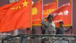A military officer salutes during a parade to commemorate the anniversary of the founding of Communist China in Beijing. Mark Schiefelbein/AP