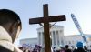 Anti-abortion protesters holding a cross demonstrate in front of the Supreme Court Building in December 2021, in Washington. AP Photo/Jose Luis Magana