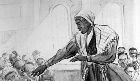 La abolicionista estadounidense y activista por los derechos de las mujeres Sojourner Truth predicando a una multitud desde un atril en un escenario, alrededor de 1860.