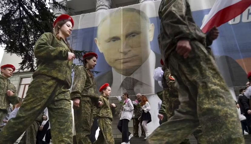  Youth take part in an action to mark the ninth anniversary of the Russian annexation of Crimea from Ukraine. AP Photo
