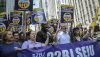 Members of a union representing workers who clean New York City offices march in 2019. AP Photo/Bebeto Matthews