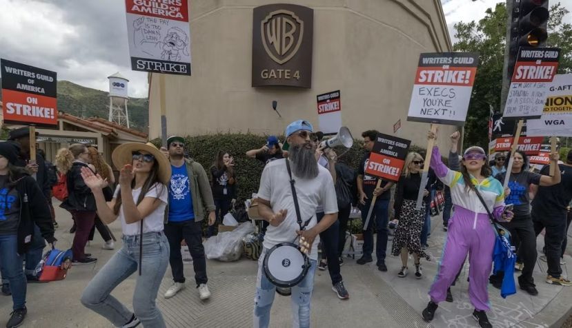 Striking workers picket outside of Warner Bros. Studios on the second day of the Hollywood writers strike on May 3, 2023, in Burbank, Calif. David McNew/Getty Images