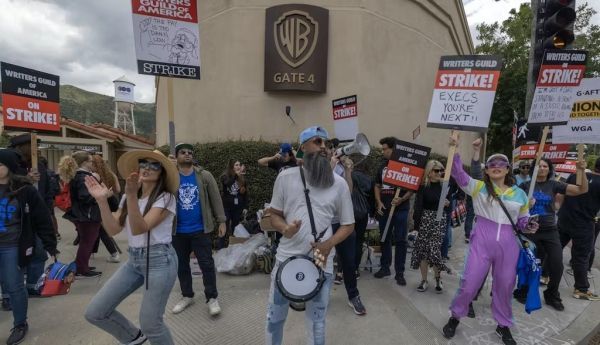 Striking workers picket outside of Warner Bros. Studios on the second day of the Hollywood writers strike on May 3, 2023, in Burbank, Calif. David McNew/Getty Images