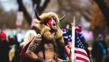 The so-called Qanon shaman, Jacob Chansley, at the Capitol riot. Shutterstock/Johnny Silvercloud