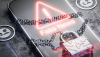  Un teléfono que muestra una alerta de "fake news" y un candado Alexander56891/Shutterstock