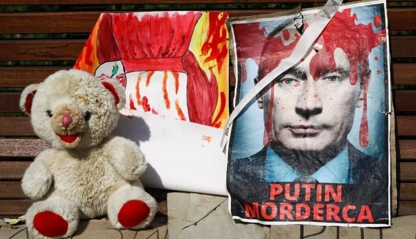 A sign reading ‘Putin, murderer’ is shown during a protest in Krakow, Poland, on May 8, 2022. Beata Zawrzel/NurPhoto via Getty Images