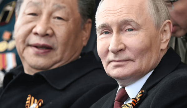 Putin and Xi attending the Victory Day military parade in Red Square, Moscow. Sergey Bobylev / Host Photo Agency Ria Novosti / EPA