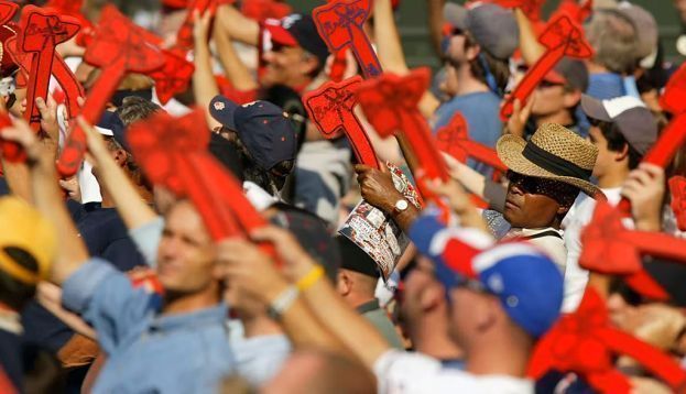 Atlanta Braves fans perform the ‘tomahawk chop’ during a playoff game in 2004. Streeter Lecka/Getty Images