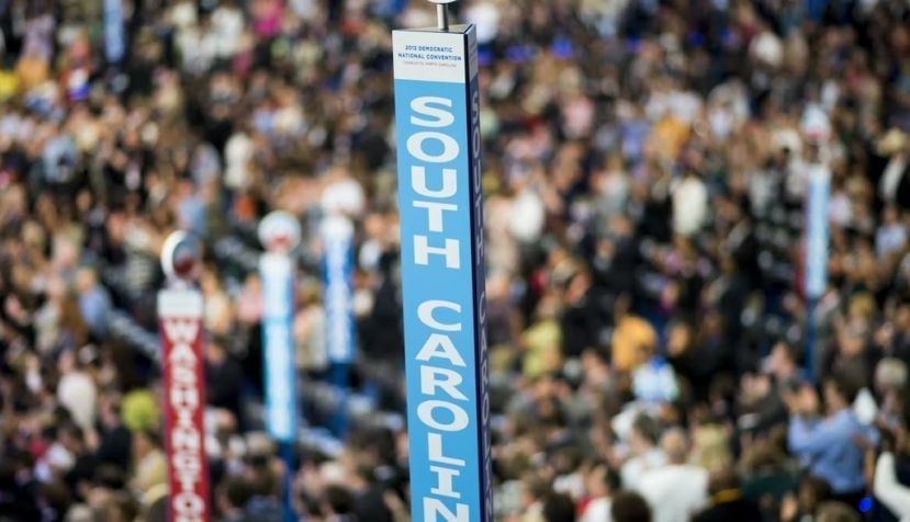 Caucusgoers stand beneath the sign for the South Carolina delegation at the Democratic National Convention. Bill Clark /CQ-Roll Call, Inc. via Getty Images