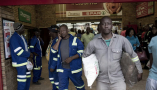 Workers shop in a grocery store in Maropong township outside Lephalale, South Africa. Per-Anders Pettersson/Getty Images