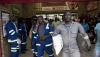 Workers shop in a grocery store in Maropong township outside Lephalale, South Africa. Per-Anders Pettersson/Getty Images