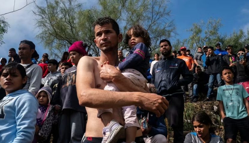 A Venezuelan asylum-seeker carries his daughter before they cross the Rio Grande into Brownsville, Texas. Veronica G. Cardenas/AFP via Getty Images