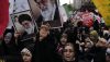 Holding posters of the Iranian Supreme Leader Ayatollah Ali Khamenei, demonstrators chant slogans in an annual rally in front of the former U.S. Embassy in Tehran on Nov. 3, 2024. AP Photo/Vahid Salemi