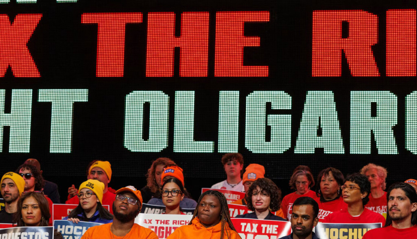 People attend a Tax The Rich rally hosted by the Democratic Socialists of America in the Bronx, N.Y., on March 29, 2026. Jason Alpert-Wisnia/Hans Lucas/AFP via Getty Images