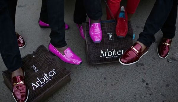 Izikhothane display their expensive Italian shoes - which they sometimes destroy in public. Per-Anders Pettersson/Getty Images