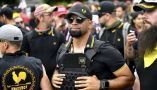 Enrique Tarrio, center, stands with other Proud Boys at a 2019 rally in Portland, Oregon. AP Photo/Noah Berger