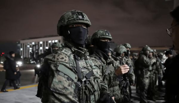 South Korean soldiers try to get into the National Assembly in Seoul on Dec. 3, 2024. Chung Sung-Jun/Getty Images