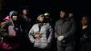 RowVaughn Wells, in gray jacket, mother of Tyre Nichols, who died after being beaten by Memphis police officers, is with friends and family members at the conclusion of a candlelight vigil for Tyre, in Memphis, Tenn., on Jan. 26, 2023. AP Photo/Gerald Herbert