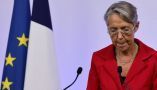 La Première ministre Elisabeth Borne juste avant son discours au soir du résultat du second tour des élections législatives 2022, qui a vu un véritable revers pour le camp macroniste. Ludovic Marin/AFP