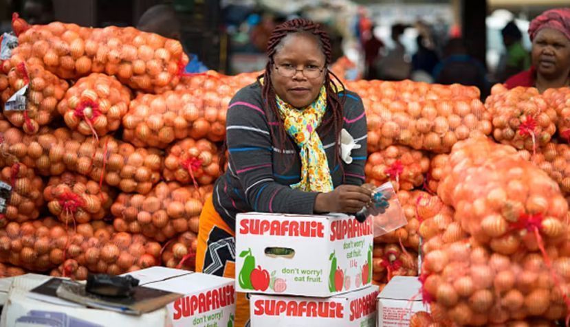 A woman selling produce at the Manzini Wholesale Produce and Craft Market in Swaziland. Edwin Remsberg/VWPics/Universal Images Group via Getty Images