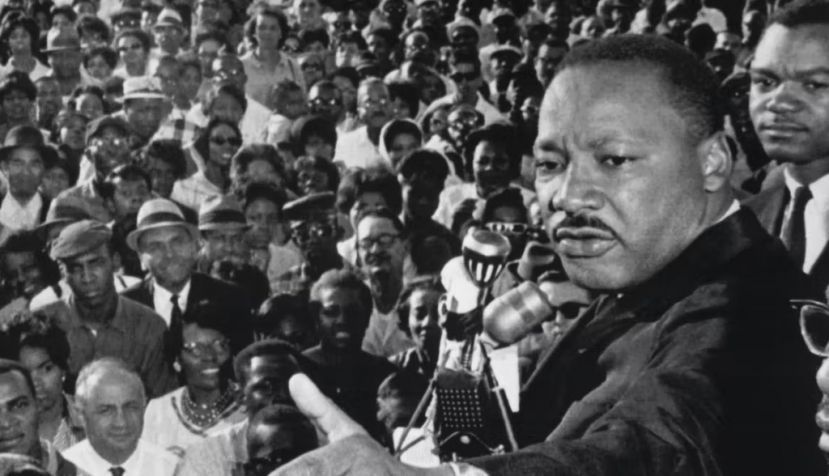 The Rev. Martin Luther King Jr. addresses a cheering crowd in Cleveland, Ohio, on July 27, 1965. Bettmann/Getty Images