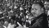 The Rev. Martin Luther King Jr. addresses a cheering crowd in Cleveland, Ohio, on July 27, 1965. Bettmann/Getty Images
