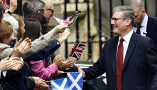  keir starmer and wife victoria meet wellwishers waving flags as he arrives at downing street after winning the general election. Sean Aidan Calderbank/Shutterstock