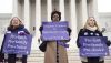 Demonstrators stand outside the Supreme Court in 2014. Saul Loeb/AFP via Getty Images