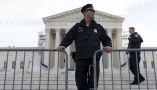 Police place a fence at the U.S. Supreme Court on Feb. 8, 2024, before justices heard arguments over whether Donald Trump is ineligible for the 2024 ballot. AP Photo/Jose Luis Magana