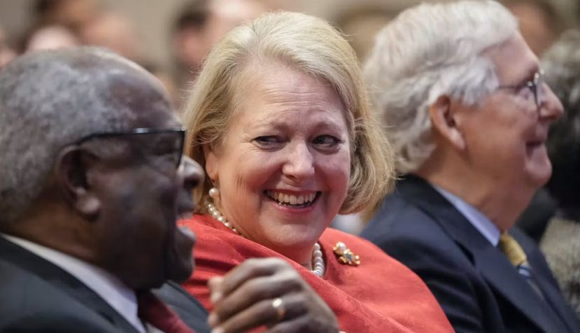 Supreme Court Justice Clarence Thomas sits with his wife, conservative activist Virginia Thomas, in October 2021. Drew Angerer/Getty Images
