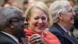 Supreme Court Justice Clarence Thomas sits with his wife, conservative activist Virginia Thomas, in October 2021. Drew Angerer/Getty Images