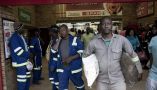 Workers shop in a grocery store in Maropong township outside Lephalale, South Africa. Per-Anders Pettersson/Getty Images